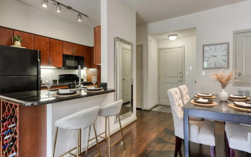 a kitchen with a table and chairs