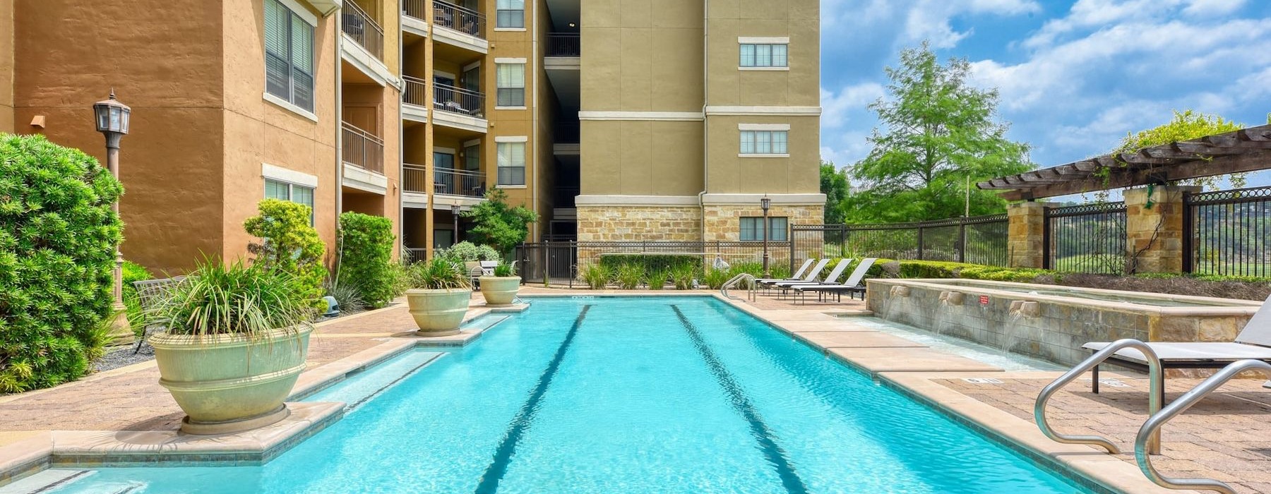 a swimming pool in front of a building